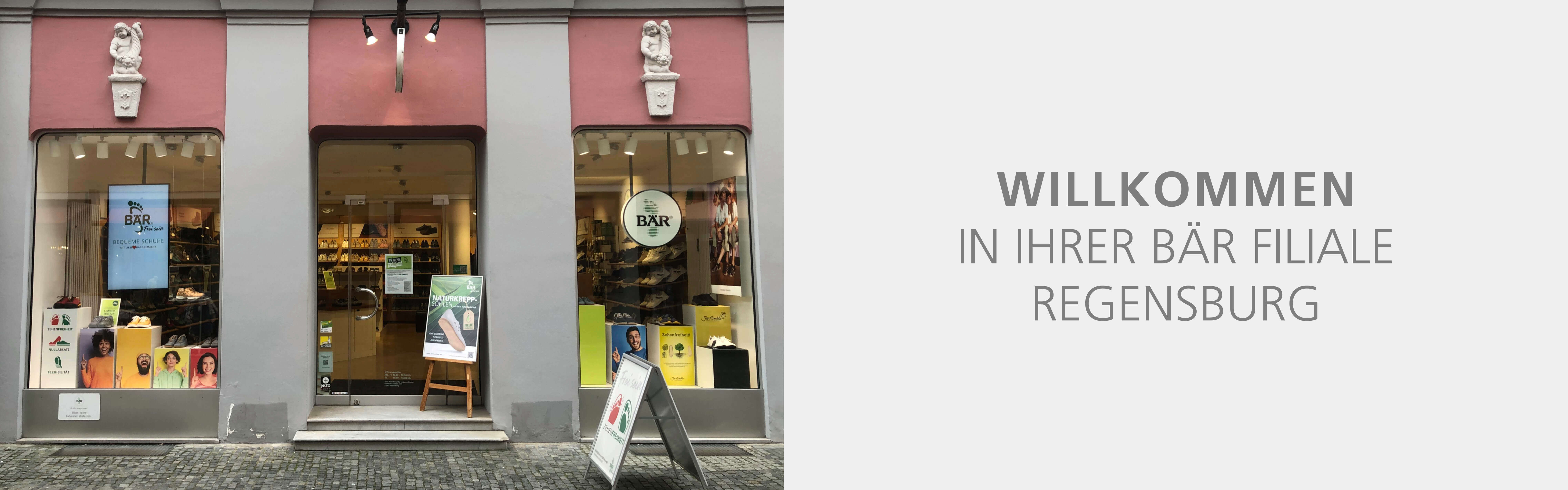 Exterior view of BÄR shoe store in Regensburg, featuring window displays and entrance.