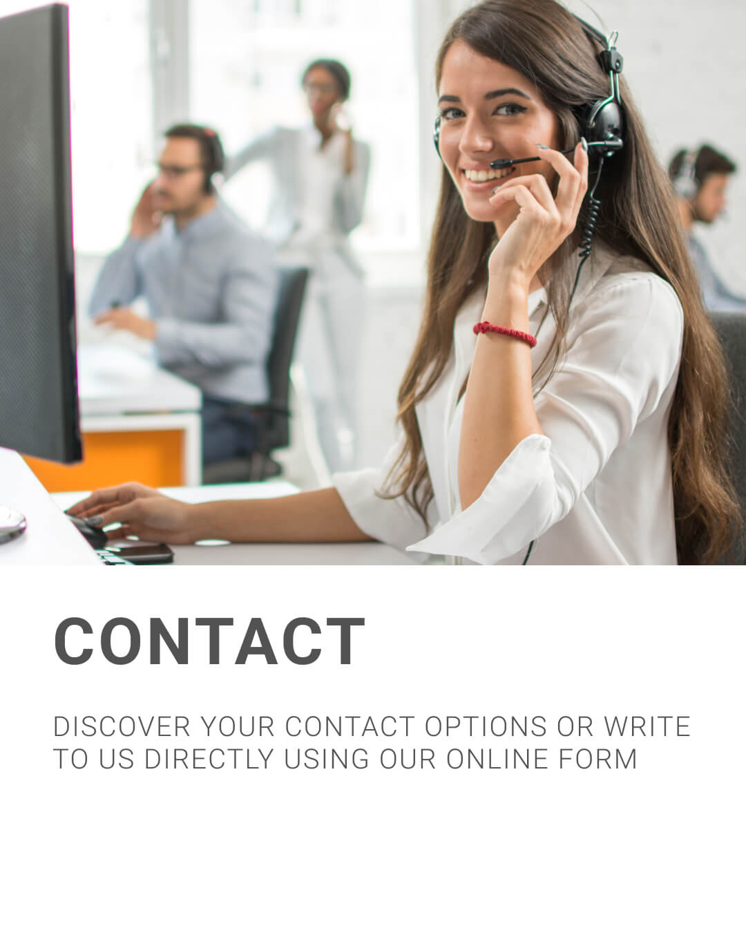 Smiling customer service representative wearing a headset at a desk in a modern office