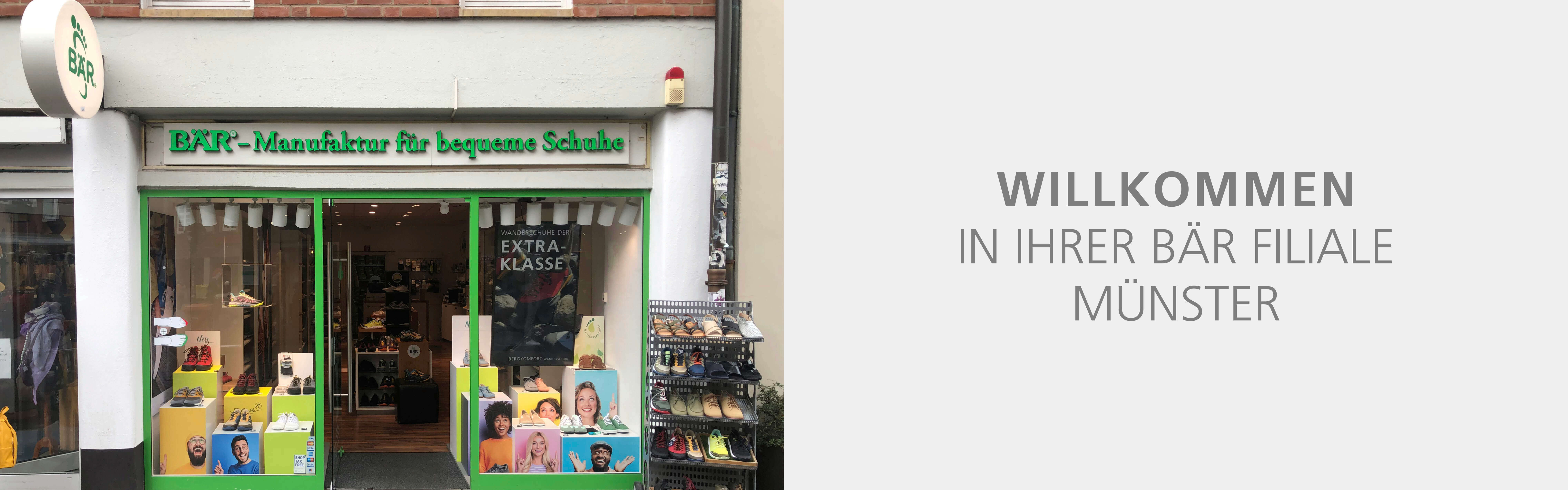 Front view of BÄR shoe store in Münster with welcoming sign and shoe displays.