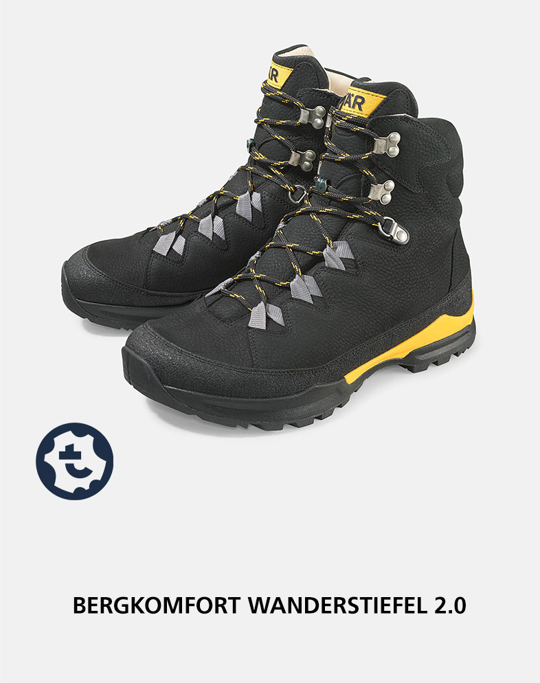 A pair of black hiking boots with yellow accents, featuring sturdy laces and rugged soles for mountain trekking.